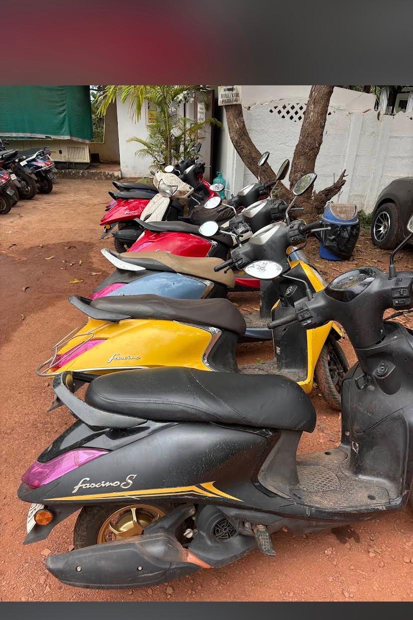 Row of scooters and scooties available for rent from ASHVEM Rides in Ashvem, North Goa